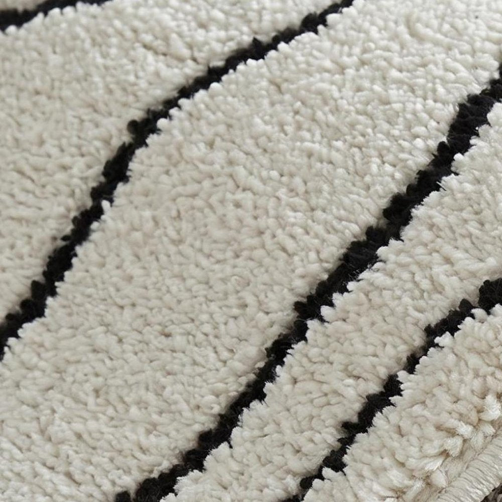 5' X 8' Cream and Black Abstract Distressed Area Rug