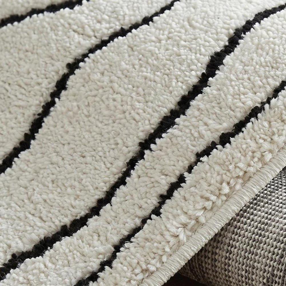 5' X 8' Cream and Black Abstract Distressed Area Rug