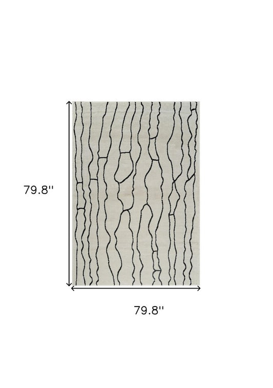 7' X 10' Cream and Black Abstract Distressed Area Rug