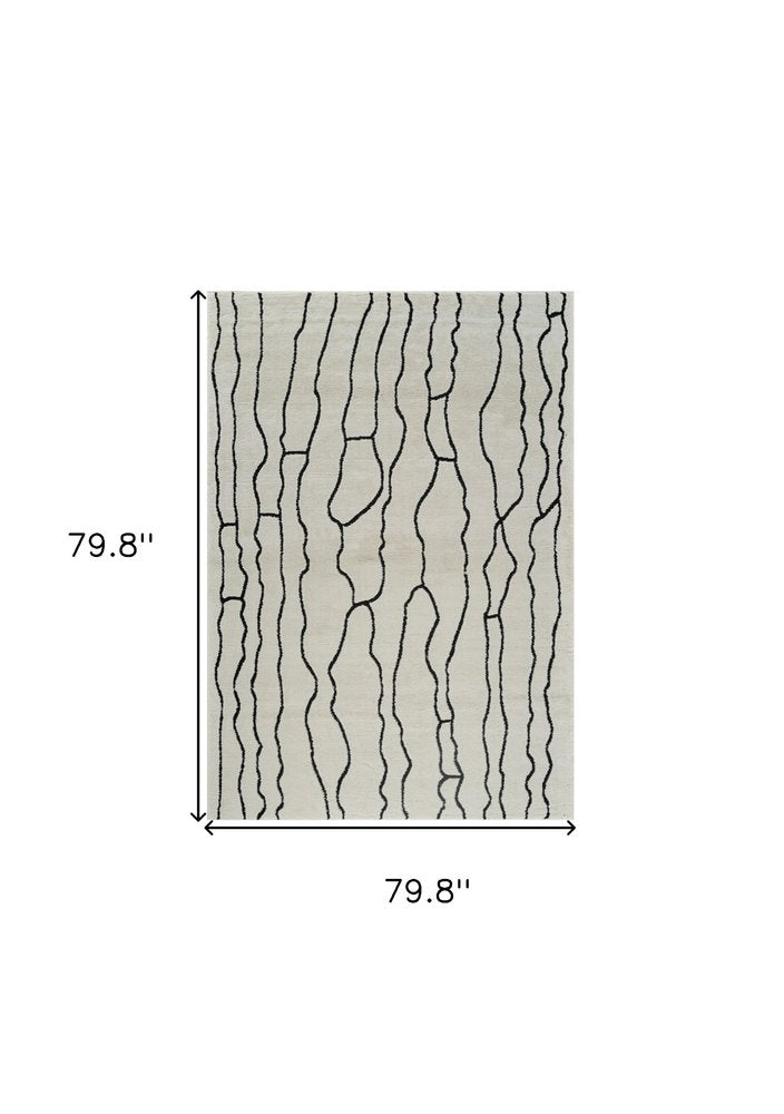 7' X 10' Cream and Black Abstract Distressed Area Rug