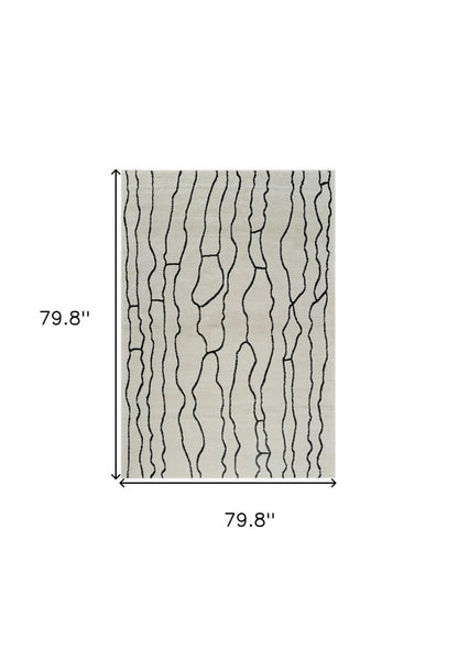 7' X 10' Cream and Black Abstract Distressed Area Rug
