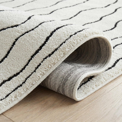 7' X 10' Cream and Black Abstract Distressed Area Rug