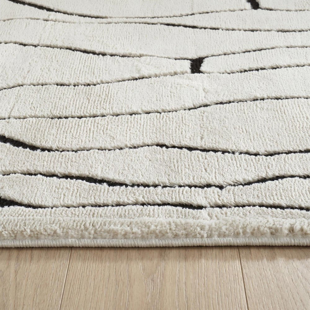 7' X 10' Cream and Black Abstract Distressed Area Rug