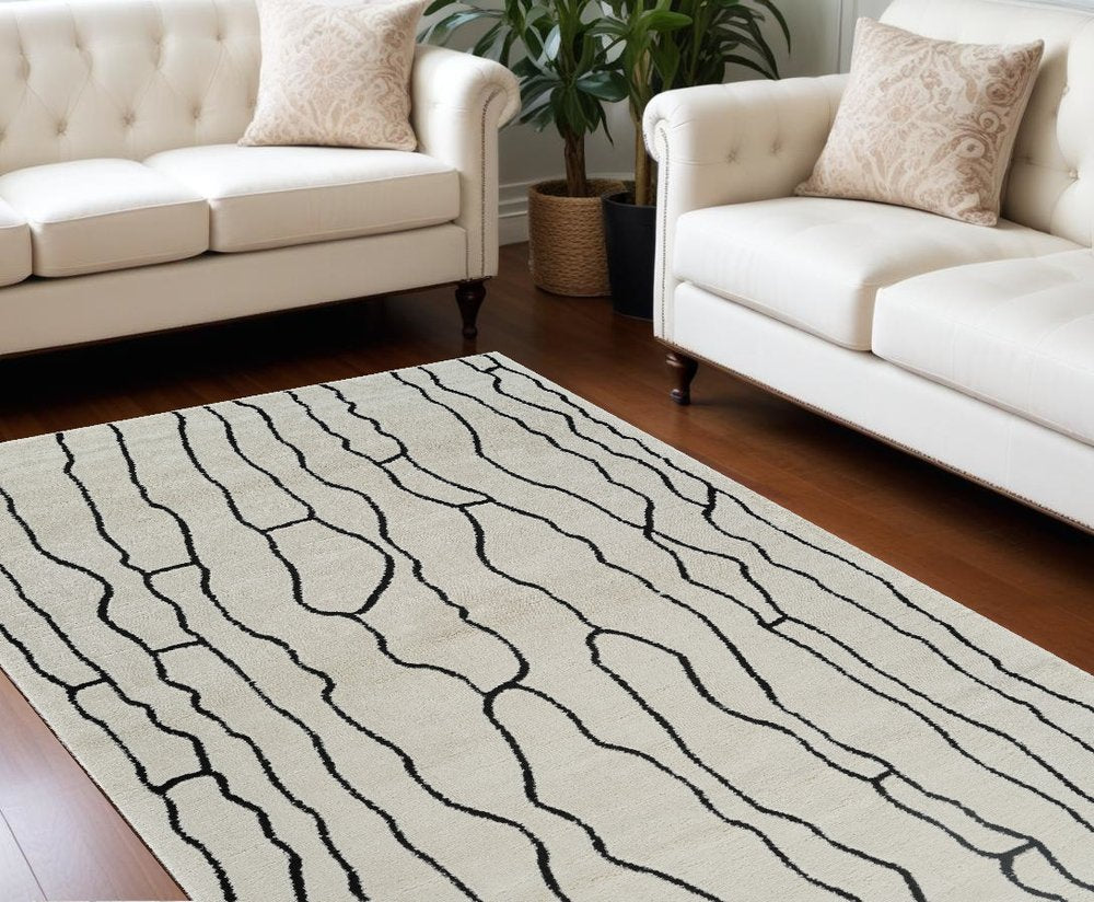 7' X 10' Cream and Black Abstract Distressed Area Rug