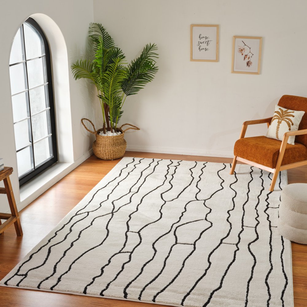 8' X 11' Cream and Black Abstract Distressed Area Rug