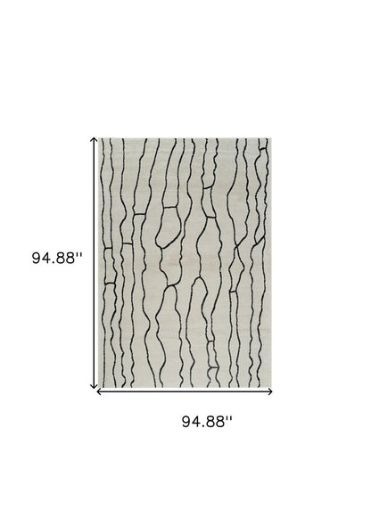 8' X 11' Cream and Black Abstract Distressed Area Rug