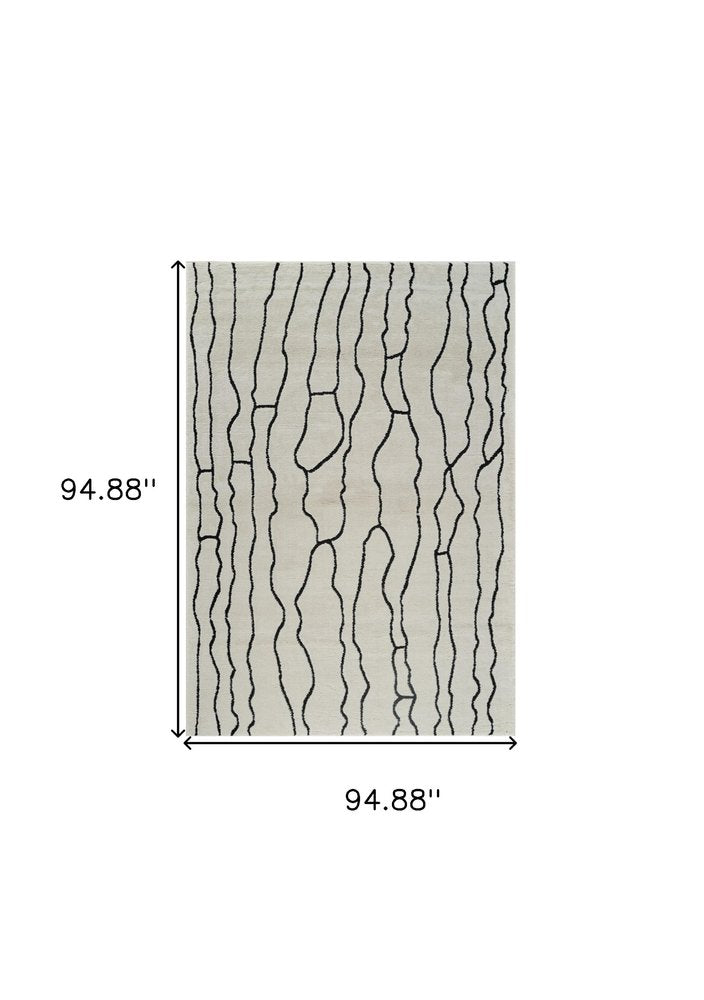 8' X 11' Cream and Black Abstract Distressed Area Rug