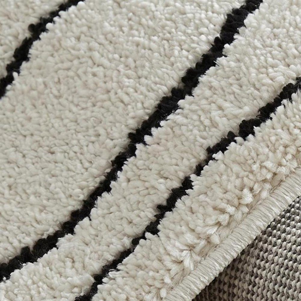 8' X 11' Cream and Black Abstract Distressed Area Rug