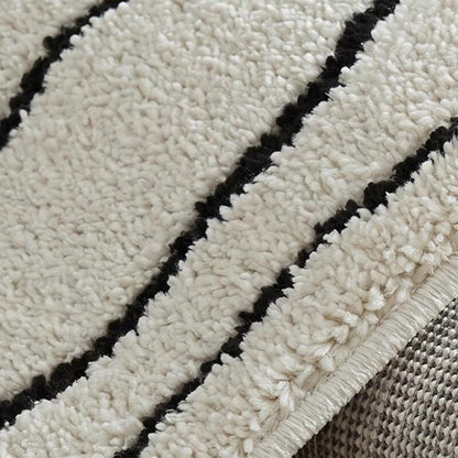 8' X 11' Cream and Black Abstract Distressed Area Rug