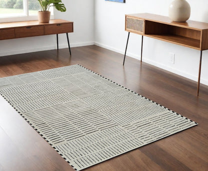 4' X 6' Cream and Black Abstract Distressed Area Rug