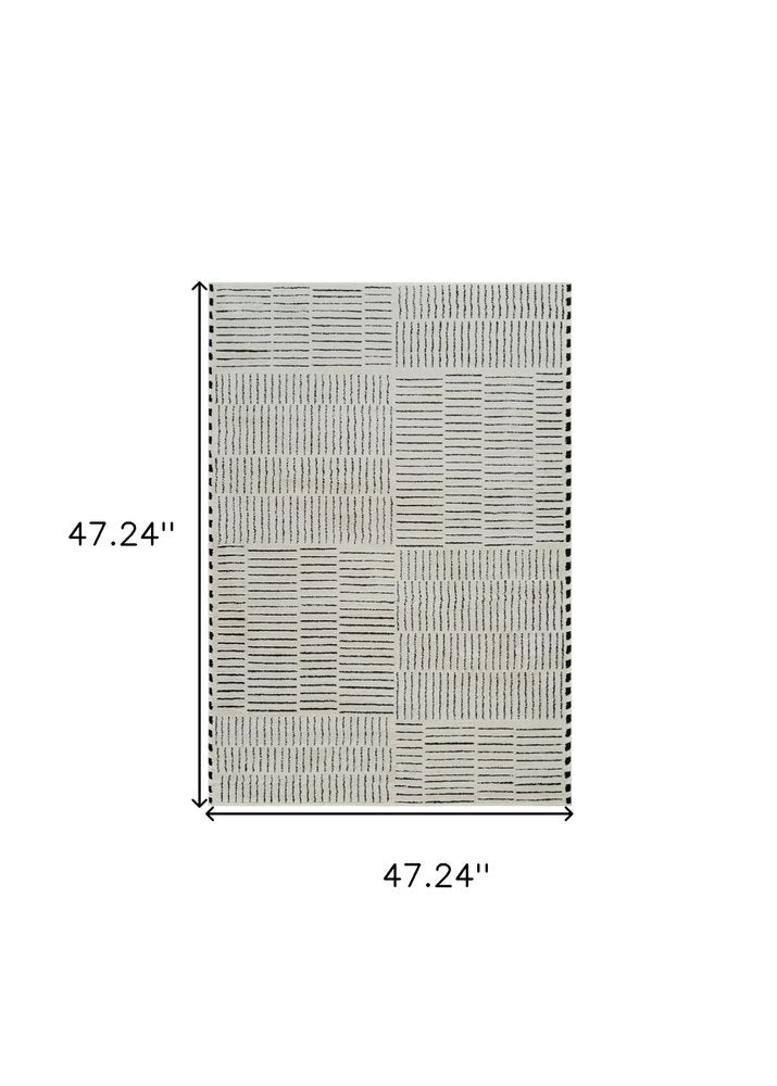 4' X 6' Cream and Black Abstract Distressed Area Rug