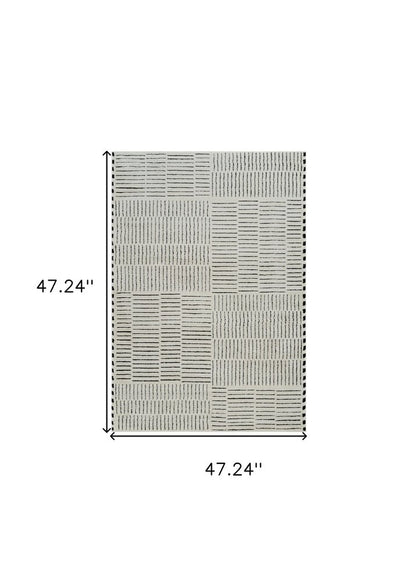 4' X 6' Cream and Black Abstract Distressed Area Rug