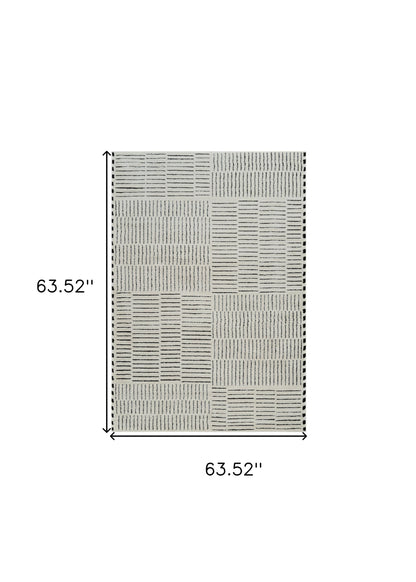 5' X 8' Cream and Black Abstract Distressed Area Rug