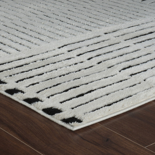 5' X 8' Cream and Black Abstract Distressed Area Rug