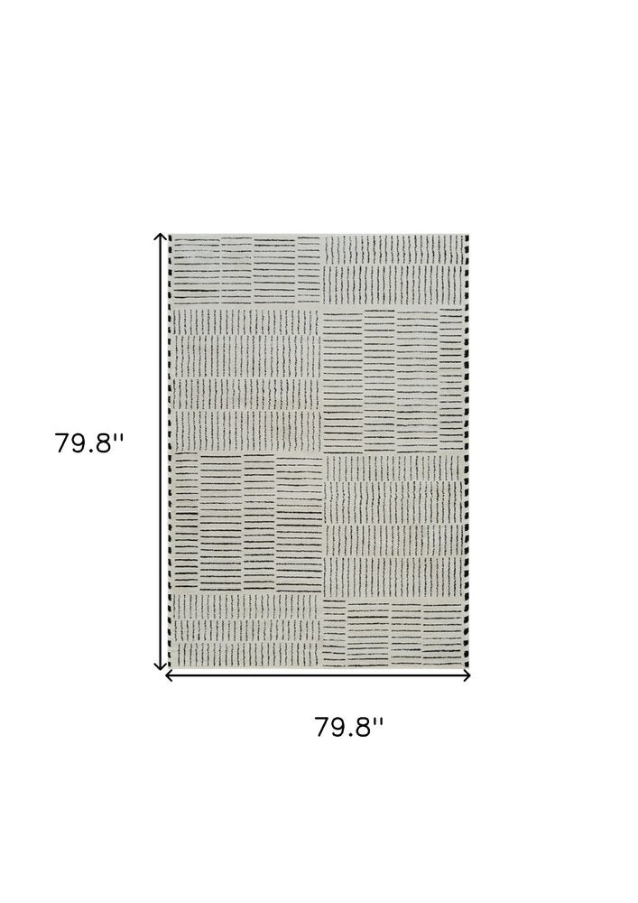 7' X 10' Cream and Black Abstract Distressed Area Rug
