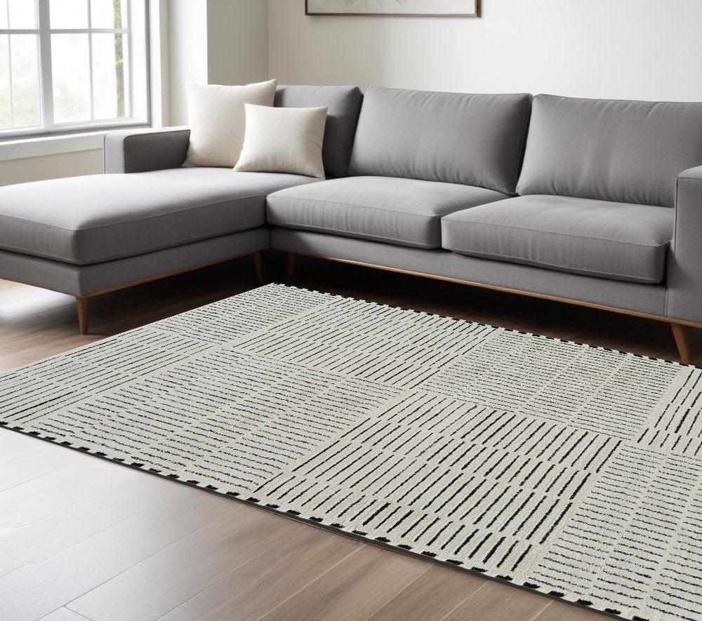 7' X 10' Cream and Black Abstract Distressed Area Rug