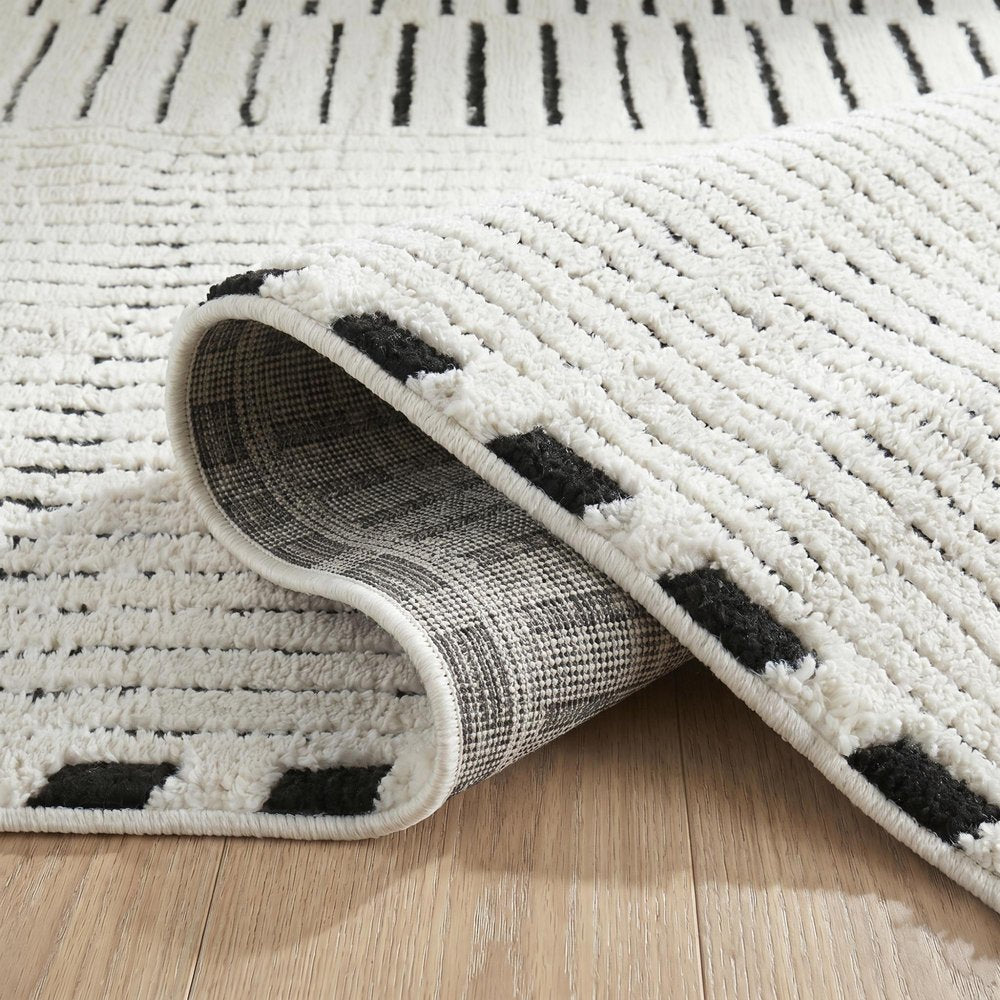 7' X 10' Cream and Black Abstract Distressed Area Rug