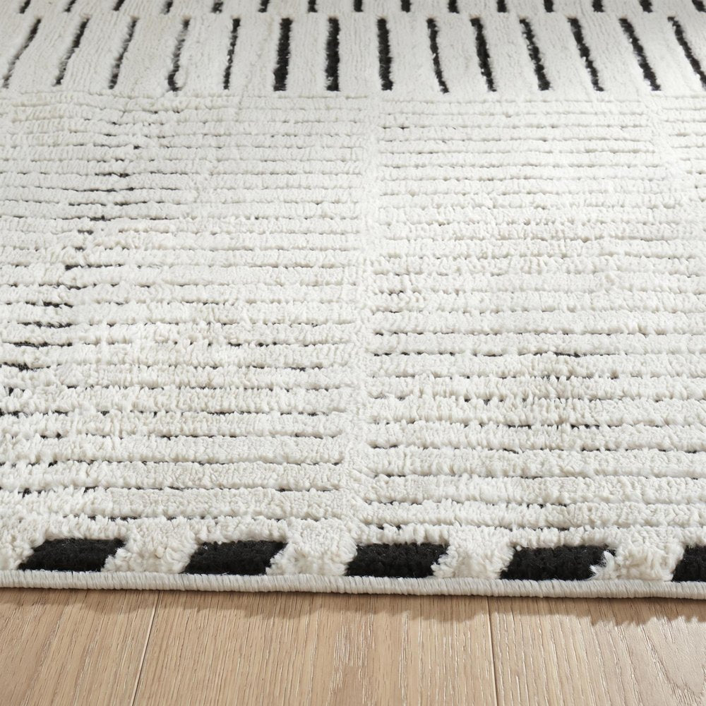 7' X 10' Cream and Black Abstract Distressed Area Rug