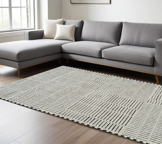 8' X 11' Cream and Black Abstract Distressed Area Rug