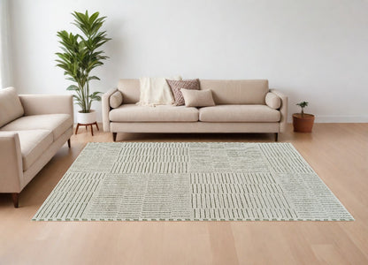 7' X 10' Cream and Green Abstract Distressed Area Rug