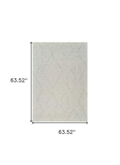 5' X 8' Cream and Beige Abstract Distressed Area Rug