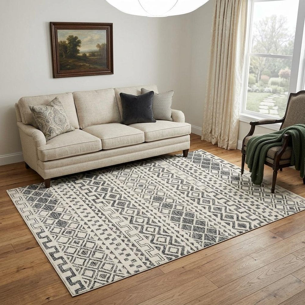 5' X 8' Black and Ivory Wool Abstract Geometric Hand Tufted Non Skid Area Rug