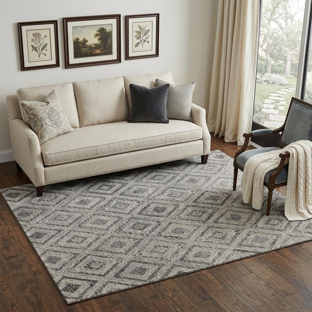 5' X 8' Black and Ivory Wool Abstract Geometric Hand Tufted Non Skid Area Rug