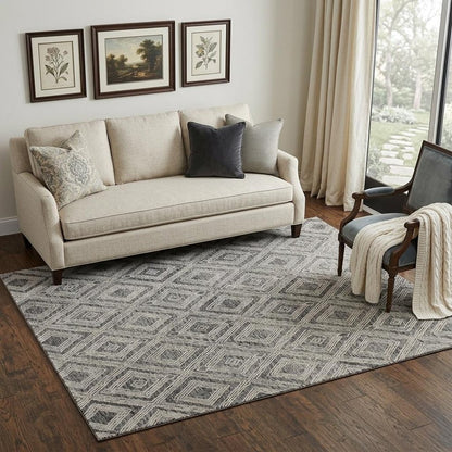 5' X 8' Black and Ivory Wool Abstract Geometric Hand Tufted Non Skid Area Rug