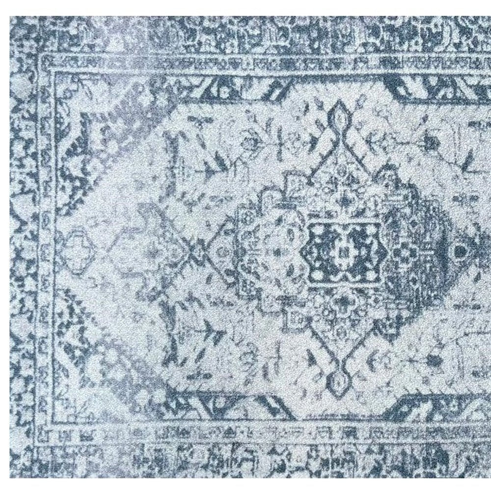 2' X 3' Dark Blue Gray And Ivory Oriental Distressed Washable Area Rug With UV Protection
